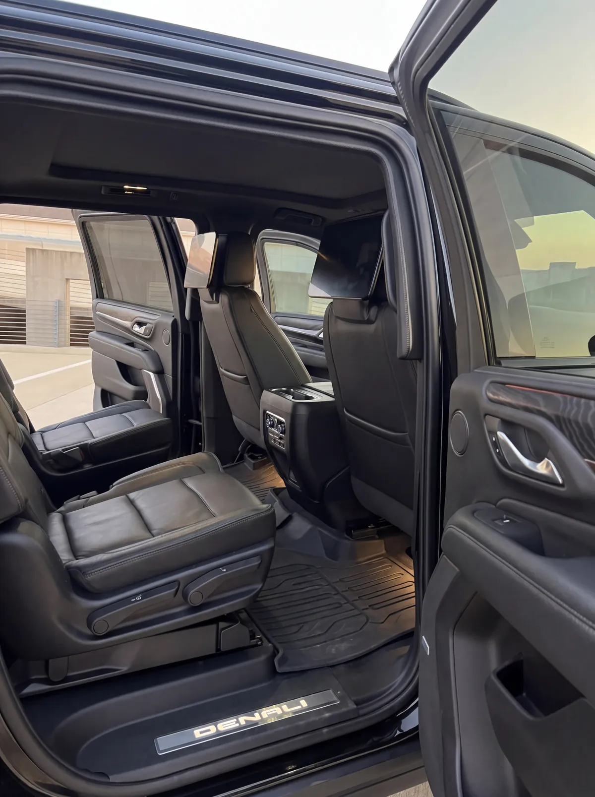 Passenger cabin of the armored GMC Yukon Denali with leather captain's chairs